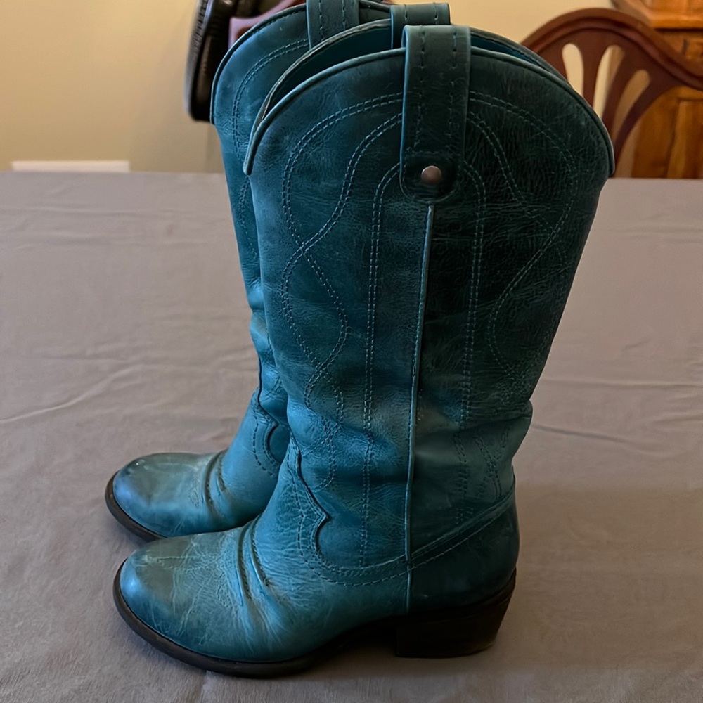 Turquoise leather boots. 2 inch heel. 6 inch calf and 13 inch shaft.